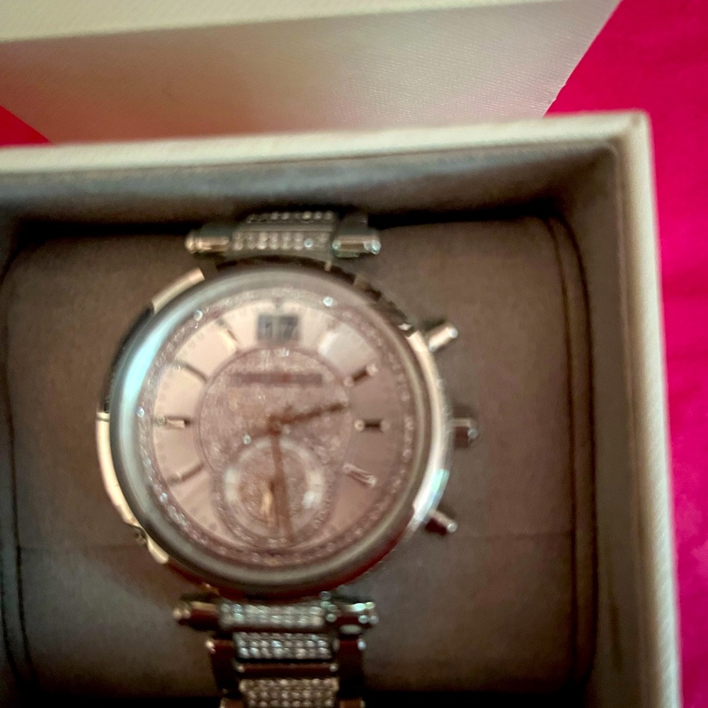 Michael Kors silver encrusted watch. In new condition